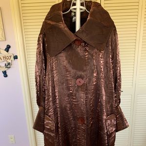 This beautiful brown jacket with vintage collar can be worn with anything